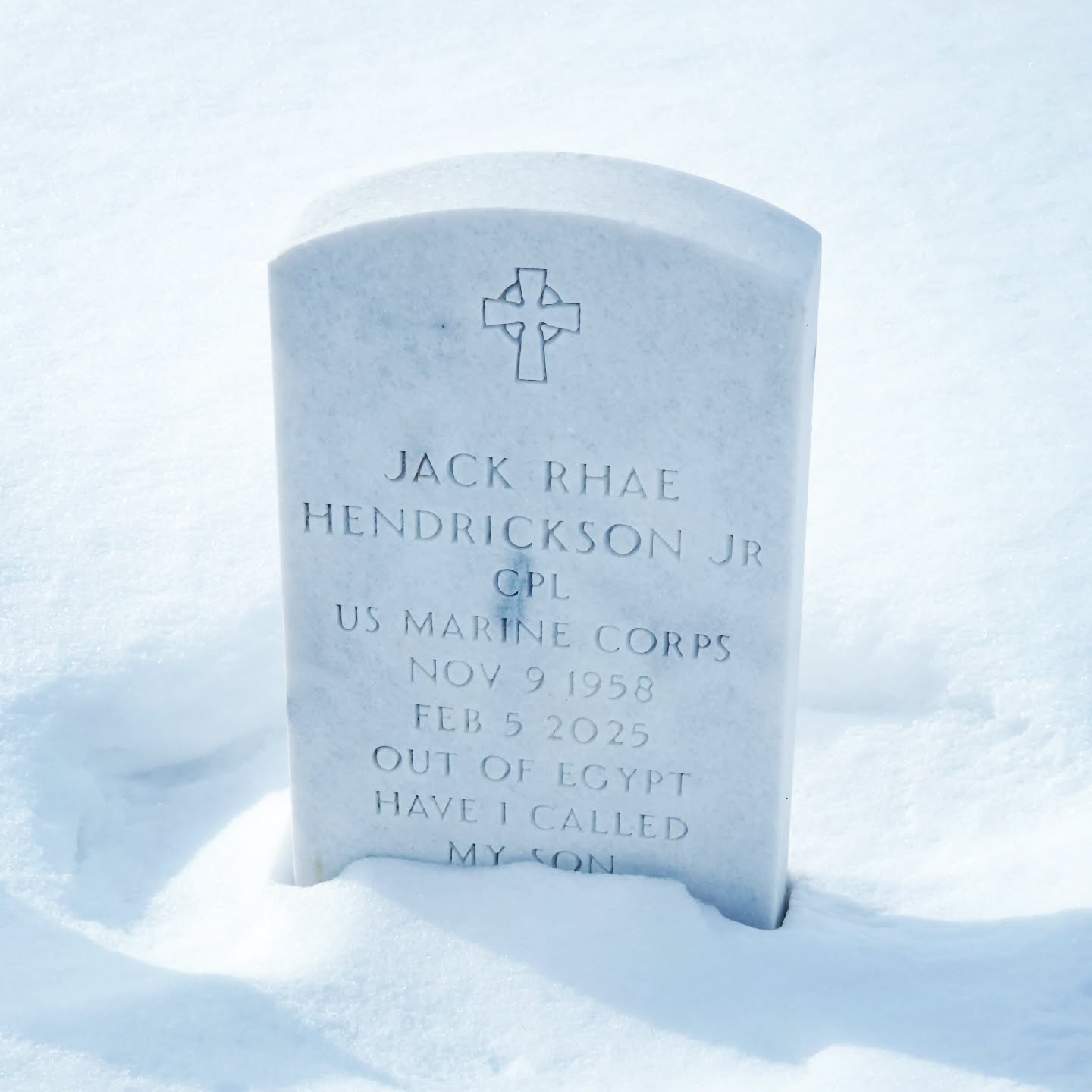 Plain marble gravestone reading "JACK RHAE HENDRICKSON JR. CPL US MARINE CORPS. NOV 9 1958. FEB 5 2025. OUT OF EGYPT HAVE I CALLED MY SON."