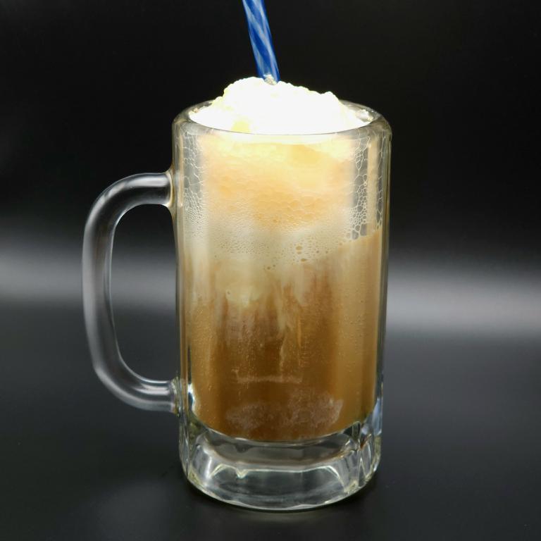 a glass mug of root beer and ice cream